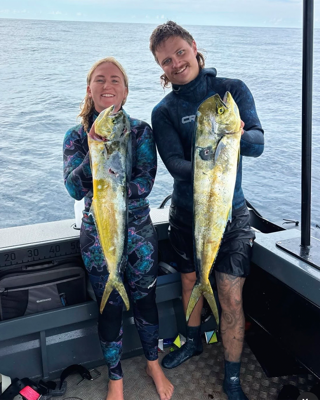 Zane and Sophie displaying their successful fishing catches from memorable day