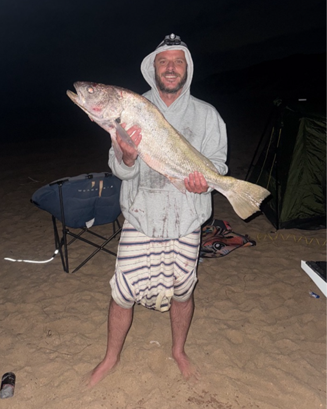 Angler Troy proudly displaying his first caught Mulloway fish
