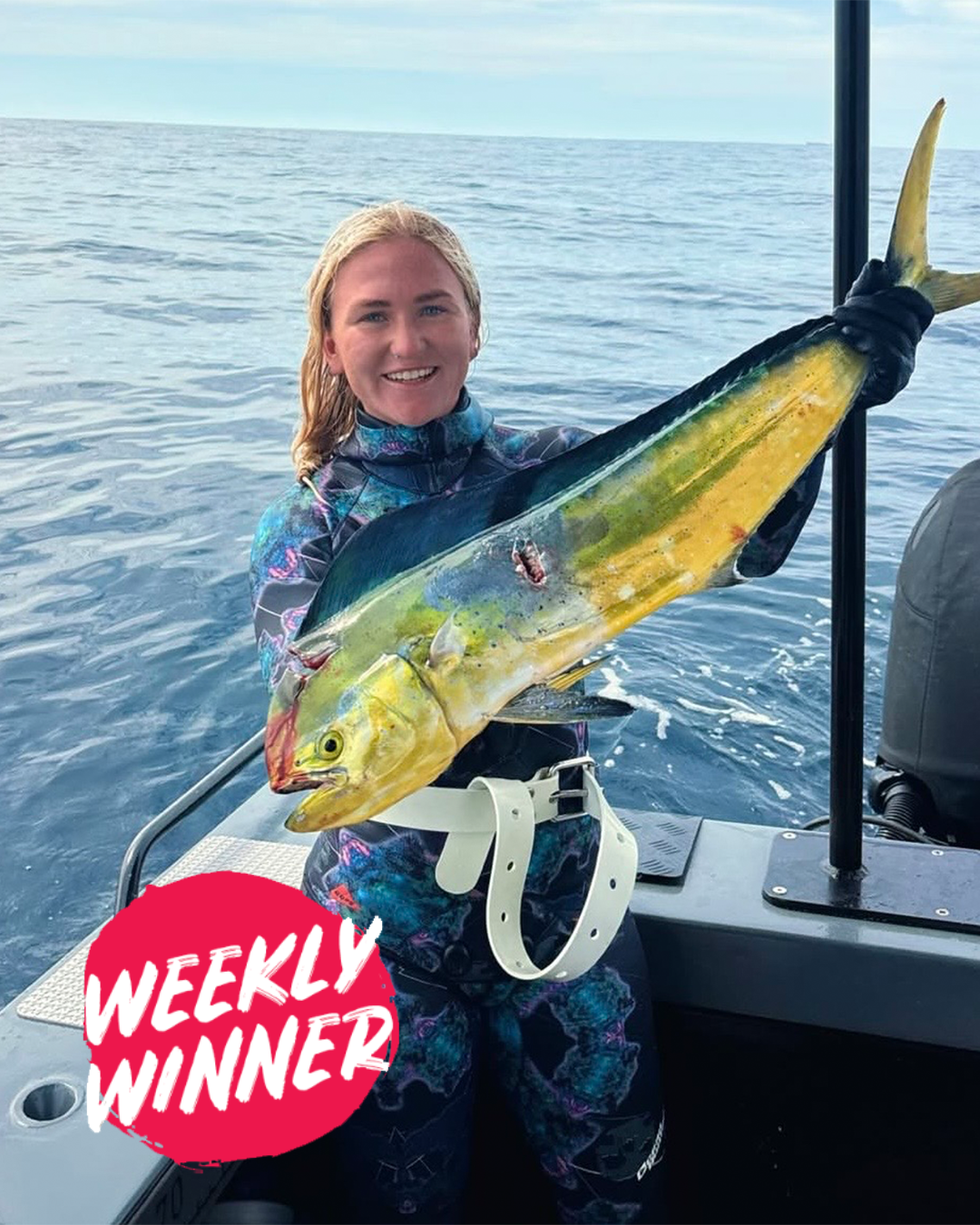 Sophie holding speared pink snapper showing successful spearfishing catch