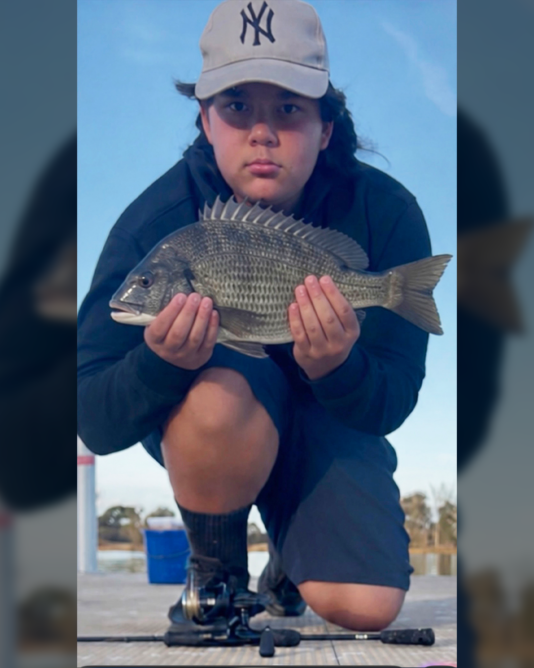Angler holding a quality bream caught on the Murray River near Mandurah
