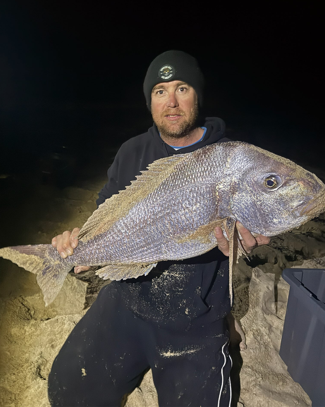 Angler John holding a solid Pink Snapper caught land-based near Mandurah