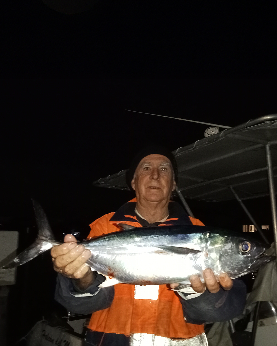 Angler Keith holding a Bluefin Tuna caught offshore during winter near Mandurah