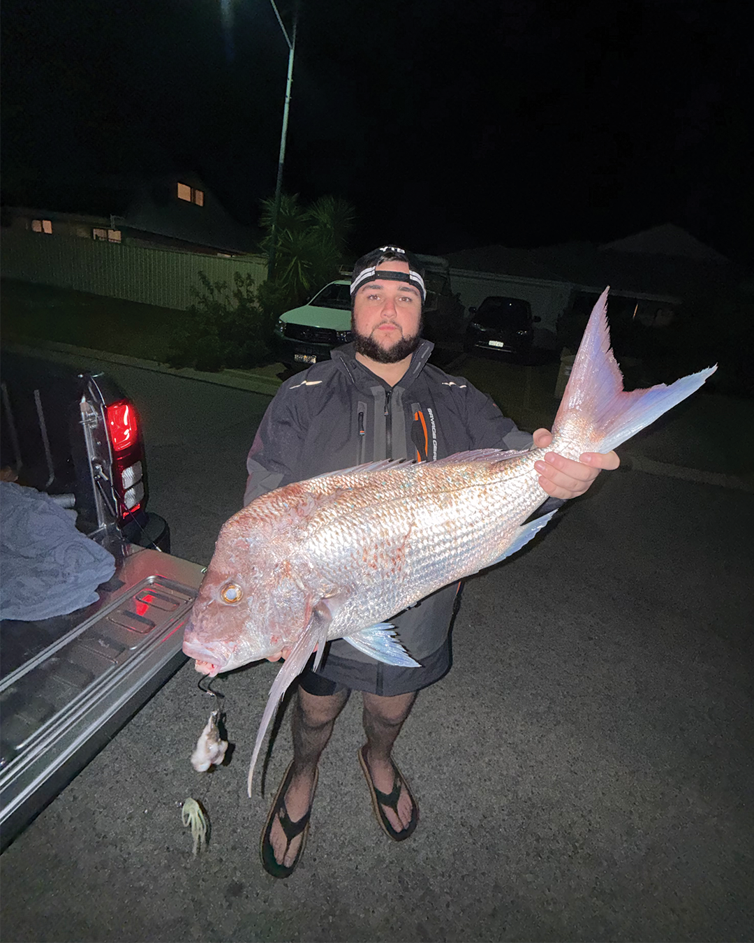 Angler Owen holding a land based Snapper caught fishing the Mandurah coastline