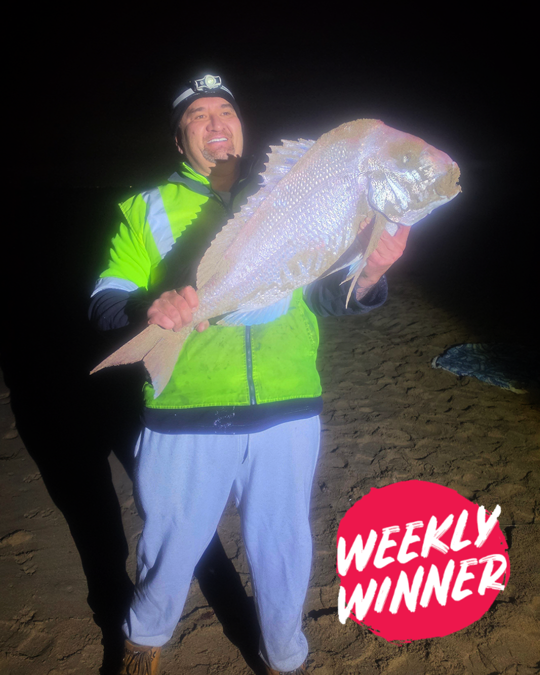 Angler Francis holding a large 95cm Pink Snapper caught from the sand in Mandurah