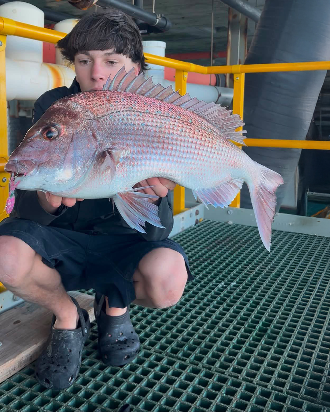 Angler Luke with a land-based pink snapper caught from the Mandurah foreshore