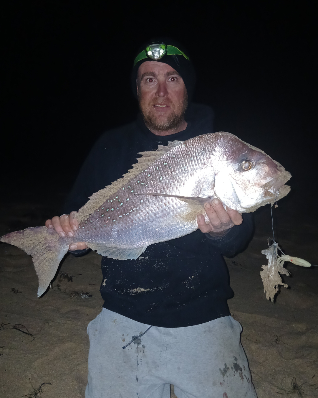 Angler John with a land-based pink snapper caught from a Mandurah beach in winter