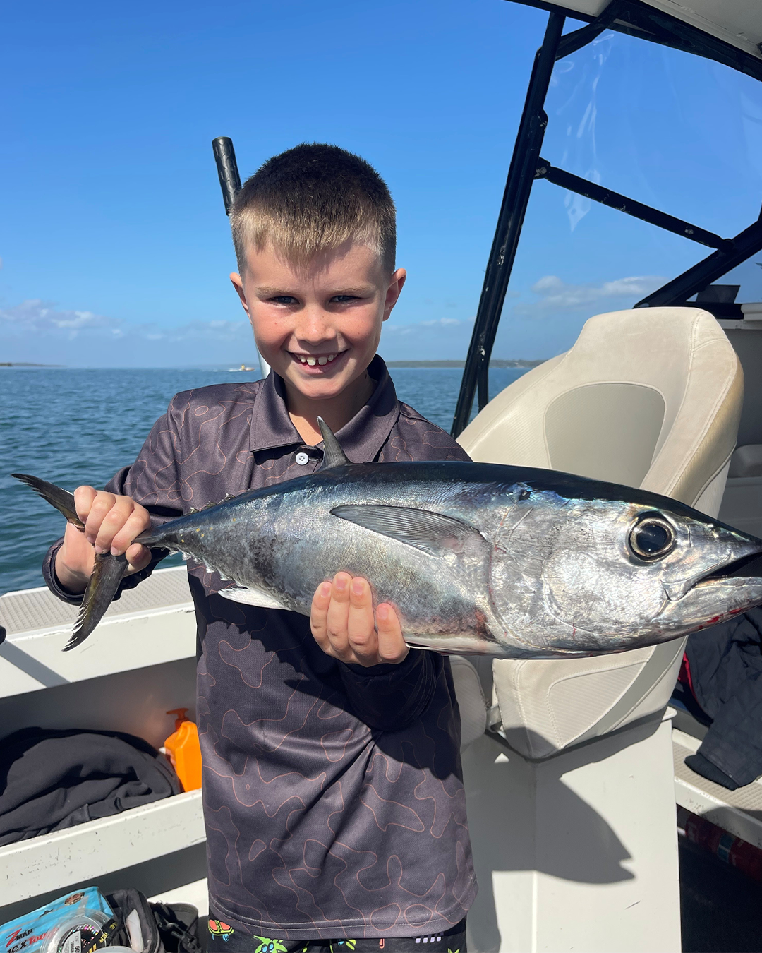 Angler holding a Southern Bluefin Tuna caught near shore off Mandurah in winter