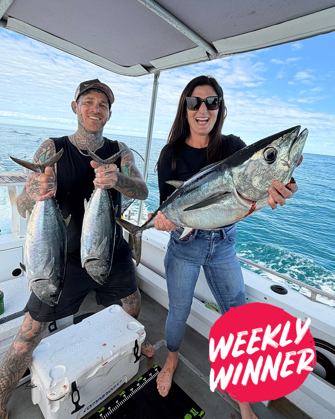 Anglers smiling with a Southern Bluefin Tuna catch while checking cray pots off Mandurah