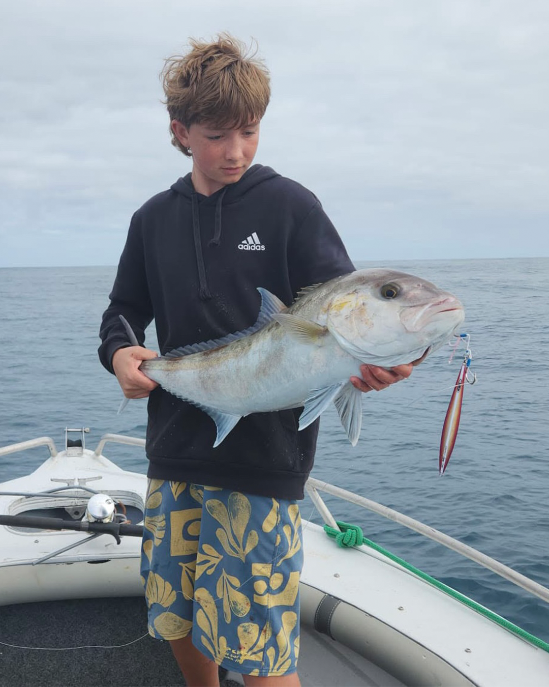 Angler Alex holding a Samson fish caught on jigs in Mandurah offshore waters during spring