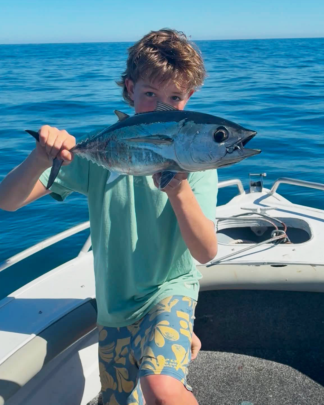 Angler Alex fighting a bluefin tuna on ultra light tackle off the Mandurah inshore reefs