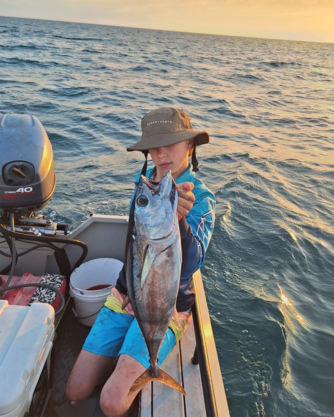 Flynn holding an inshore bluefin tuna caught off the Mandurah coast during spring