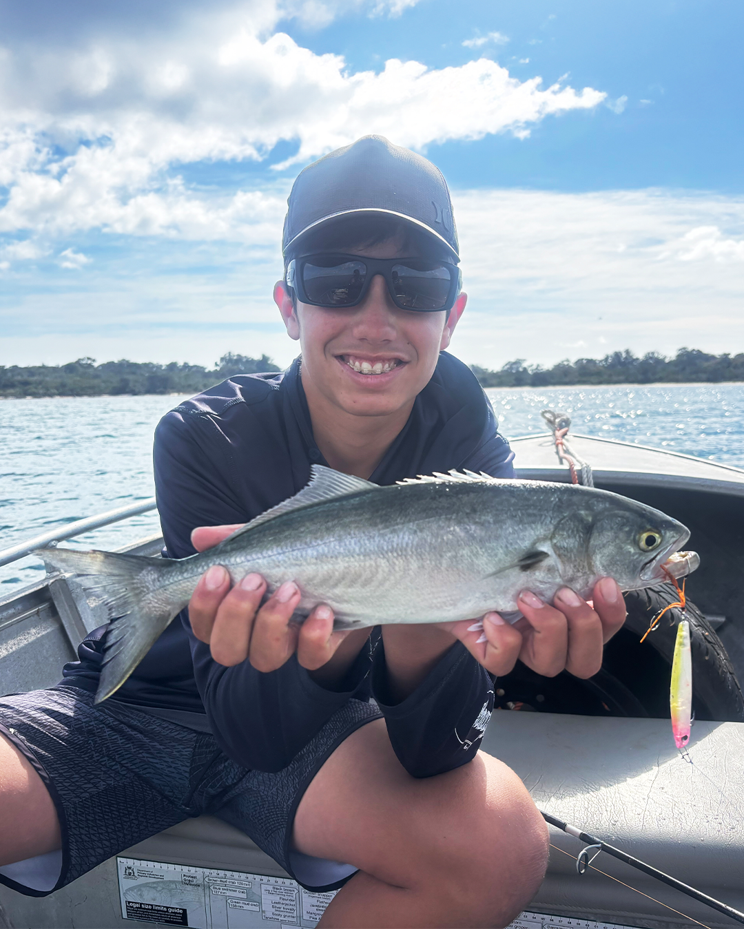 Angler Hayes holding a 40cm Tailor caught on surface lures in the Mandurah estuary