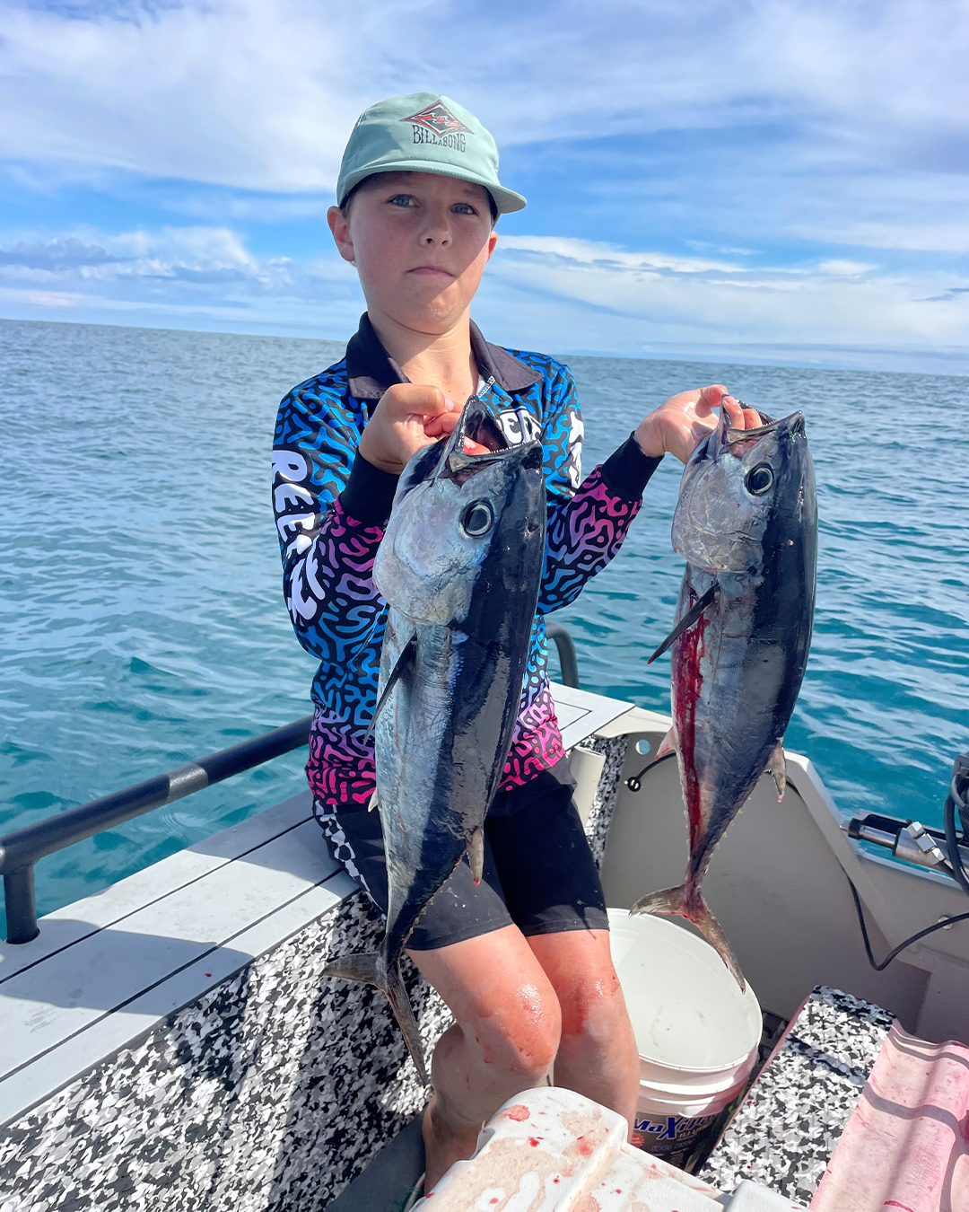 Young angler Jasper holding a chunky bluefin tuna caught offshore near Mandurah