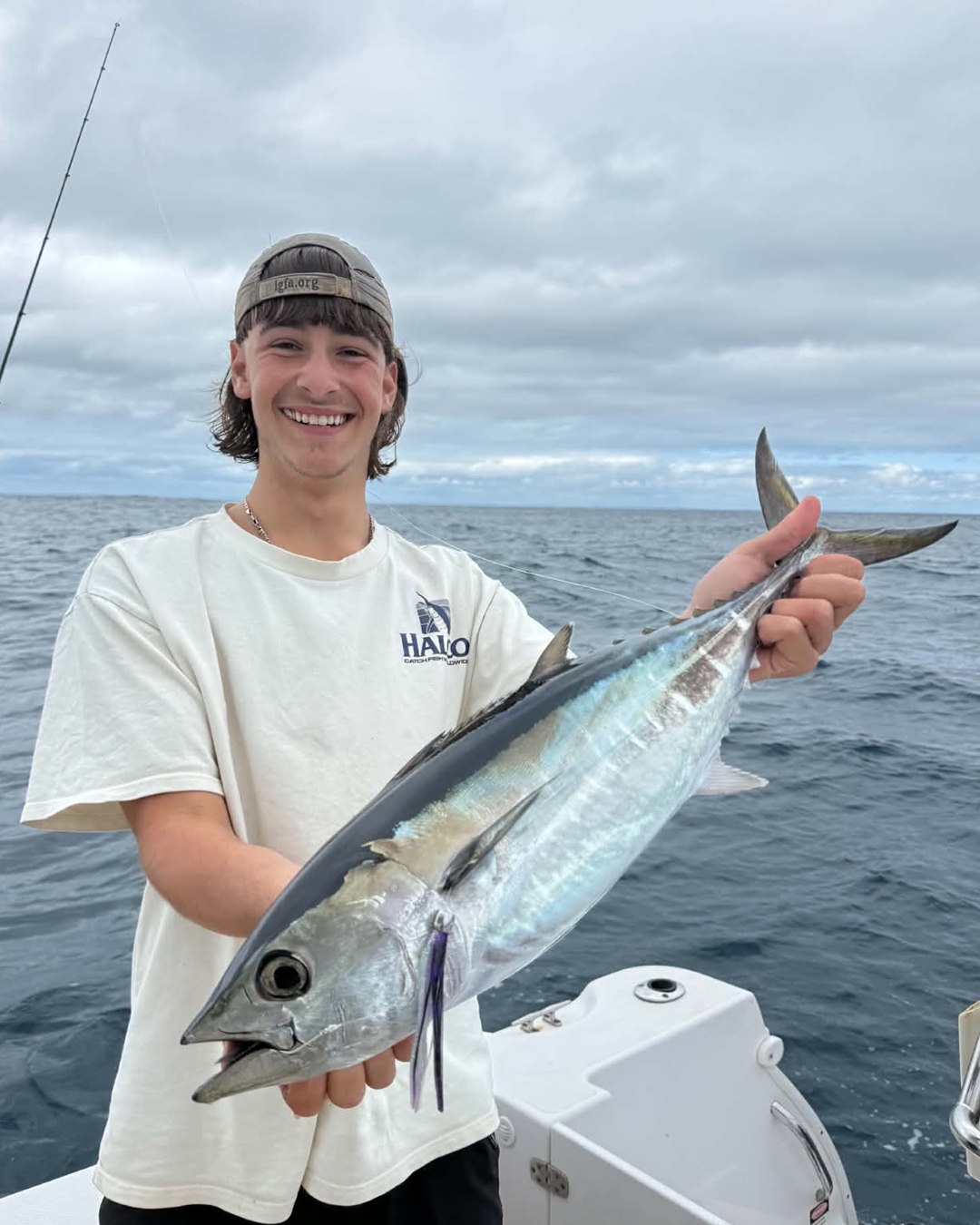 Angler Lochy targeting fast pelagic fish using light line class gear off Mandurah