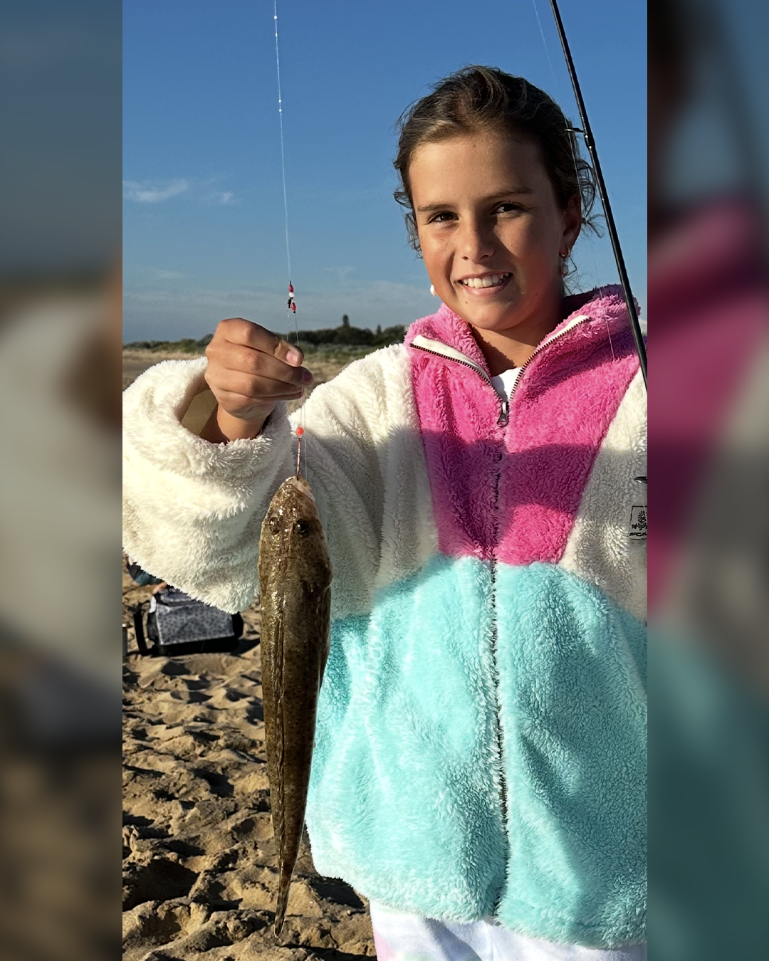 Angler Nyah holding an uncommon Flathead caught from the local Mandurah beaches