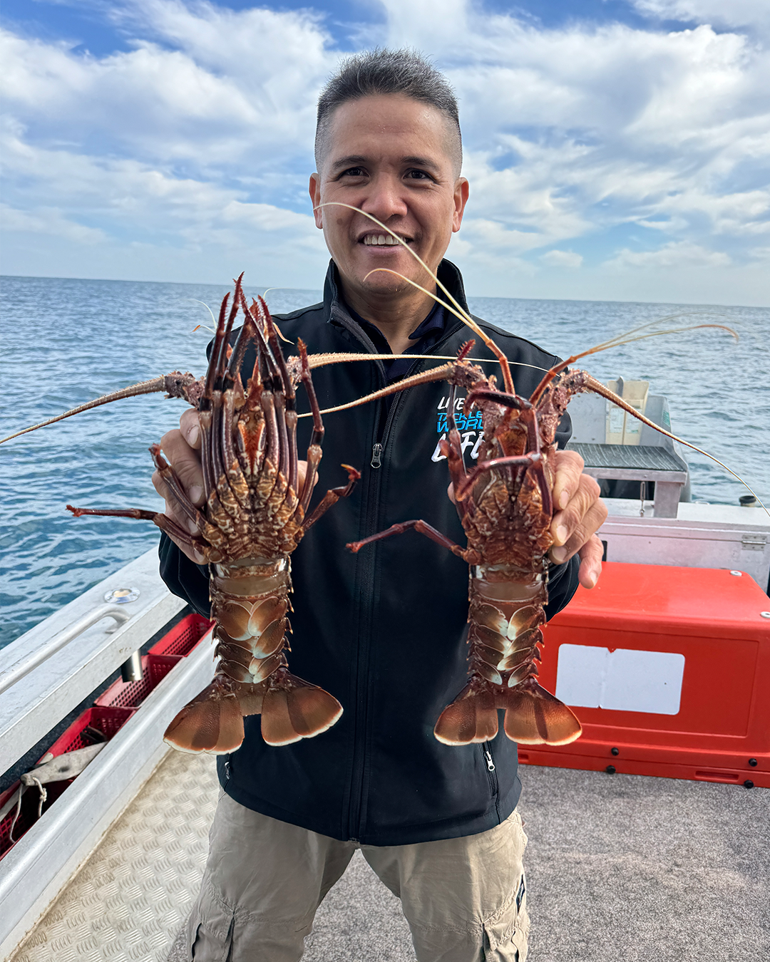 Angler holding Red Snapper caught offshore Mandurah showing good conditions