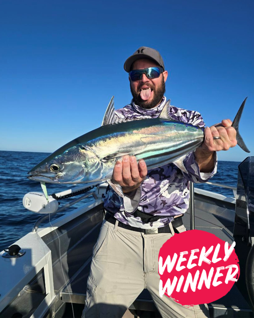 Angler Ryan holding a Bluefin Tuna caught on the cast in Mandurah waters